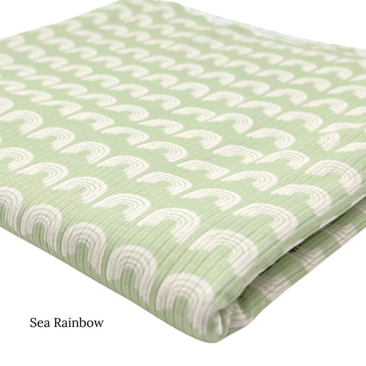 White Rainbow on Light Green Fabric